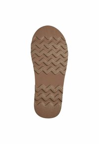 Brun gummisål med zigzag-mønster til traction, tekstureret overflade for greb og rund tå med en glat finish.
