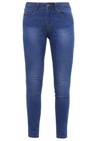 Vaqueros skinny azul denim con textura suave, cinco bolsillos y detalles de costura sutiles. Cuenta con cierre estándar de cremallera y botón.