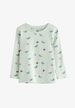 Vihreä pitkähiha topi, jossa on perhonen kuvio sinisessä, violetissa ja vaaleanpunaisessa. Pehmeä kangas, pyöreä pääntie ja rento malli.