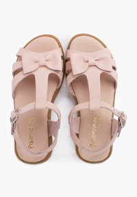 Sandali in pelle rosa con dettaglio a fiocco, design open toe, cinturino alla caviglia regolabile e soletta texturizzata. Suola in gomma piatta.