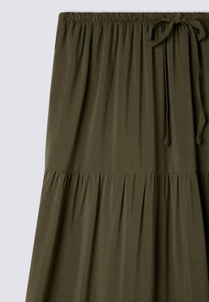 Oliwkowa, średniej długości spódnica z miękkiego materiału, z marszczonym, elastycznym pasem i wiązaniem z przodu. Rozkloszowany krój.