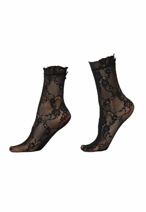 Chaussettes courtes noires transparentes avec motif en dentelle florale et bords supérieurs volantés, présentées sur des formes en forme de pied sur fond blanc.