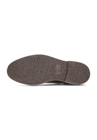 Suela de zapato de goma con superficie texturizada, de color marrón oscuro y una ligera curvatura en el talón. Presenta un pequeño acento rectangular.