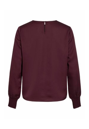 Blusa de manga larga burdeos con abertura en la espalda, textura suave y mangas fruncidas, que presenta un ajuste relajado y un diseño minimalista.