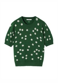 Pull court à manches courtes vert avec un col rond, décoré de grands pois blancs sur l'ensemble du design. Fabriqué en maille douce.