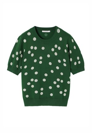 Pull court à manches courtes vert avec un col rond, décoré de grands pois blancs sur l'ensemble du design. Fabriqué en maille douce.