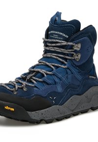 Stivale da trekking a metà altezza in suede blu navy e tessuto. Design impermeabile, punta rinforzata, lacci grigi, suola Vibram per una migliore aderenza.