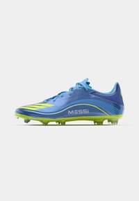 Light blue soccer cleat with green accents, featuring a smooth material, a curved design, and Messi branding on the side.
