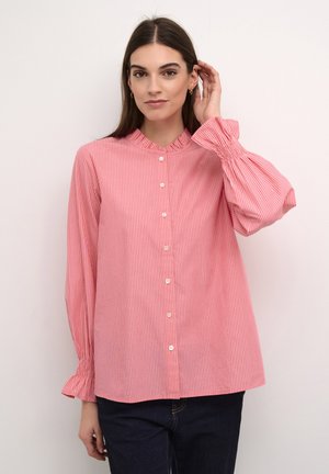 Rot-weiß gestreifte Bluse mit mandarinischem Kragen und puffierten Ärmeln. Hergestellt aus leichtem Stoff mit glatter Textur.