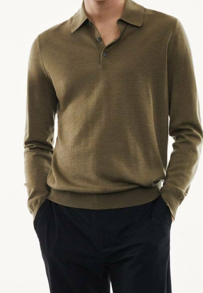 Olive green long-sleeve polo shirt with a collared neck, three button placket, and ribbed cuffs. Smooth texture and fitted design.