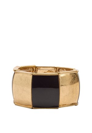 Bransoletka na rozciąganie z naprzemiennymi dużymi czarnymi i złotymi prostokątnymi metalowymi ogniwami na białym tle.