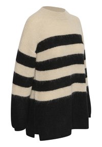 Ylisuuri villapaita, jossa on kerma- ja mustanauristripejä. Valmistettu pehmeästä, teksturoidusta materiaalista, jossa on joustomekko ja roikkuneet hartiat.