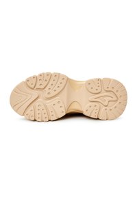 Talpă de pantof de culoare bej deschis, cu cauciuc texturat și modele variate, puncte de prindere pentru aderență.
