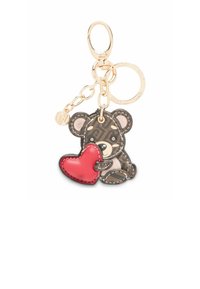 Ādas atslēgu piekariņš ar lāci, kurš tur sarkanu sirdi. Lācim ir rakstains brūns ķermenis ar gaišiem akcentiem un zelta tonējums aparatūru.