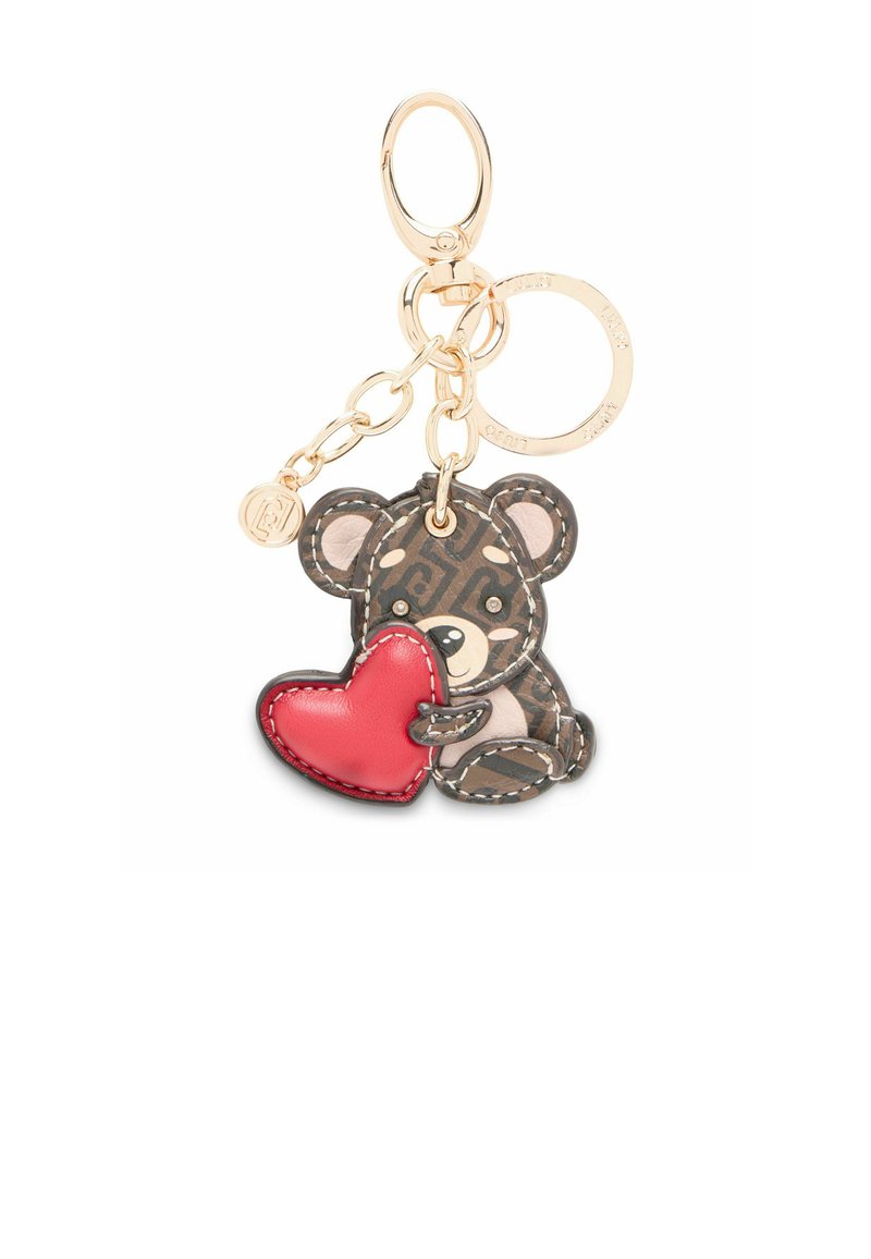 Ādas atslēgu piekariņš ar lāci, kurš tur sarkanu sirdi. Lācim ir rakstains brūns ķermenis ar gaišiem akcentiem un zelta tonējums aparatūru.