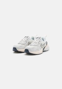 Light gray athletic shoes with mesh and synthetic upper, featuring a navy accent, white sole, and prominent cushioning design.