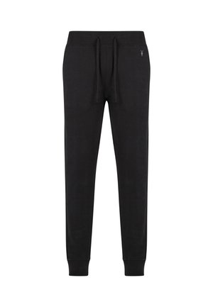 Schwarze Jogginghose aus weichem Stoff, mit einem elastischen Bund und Kordelzug, schmal zulaufenden Beinen und minimaler Gestaltung.