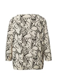 Florale Bluse mit cremefarbenem Hintergrund, versehen mit schwarzen Umrissen großer Blumen und Blätter, lockerer Schnitt und Dreiviertelärmel.