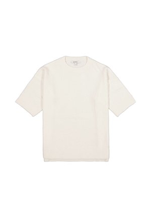 Witte gebreide trui met korte mouwen en een ronde hals. Zacht van textuur en met een losse pasvorm. Geribbelde manchetten en zoom zorgen voor subtiele details.