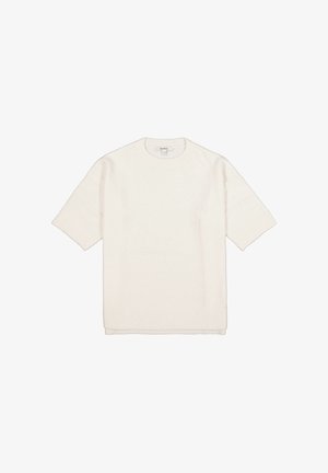 Pull en maille blanc à manches courtes avec un col rond. Texture douce et coupe ample. Poignets et ourlet côtelés apportant des détails subtils.