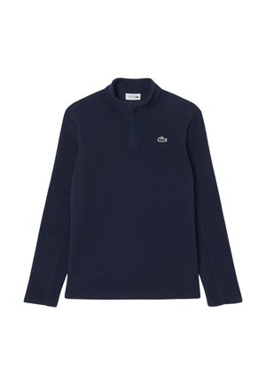 Pullover in pile della Marina con collo a zip, caratterizzato da un piccolo logo verde sul petto, maniche lunghe e una superficie liscia in tutta la sua estensione.