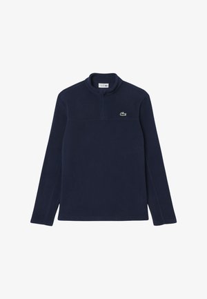 Marine kleur fleece pullover met een ritskraag, voorzien van een klein groen logo op de borst, lange mouwen en een gladde textuur door het hele kledingstuk.