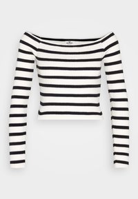 Haut à rayures noires et blanches, côtelé, à manches longues et dénudé sur les épaules. Présente une silhouette ajustée et une longueur courte.