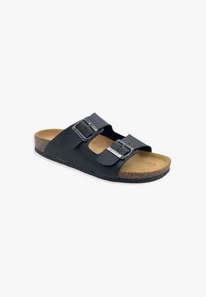 Sandal in nero con due cinturini e fibbie in metallo argentato, suola intermedia in sughero e suola esterna in gomma texturizzata. Design piatto adatto per un utilizzo casual.
