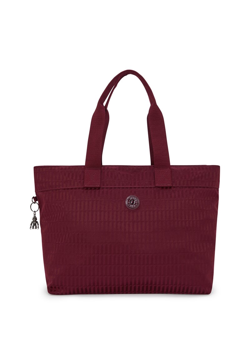 Burgundy tote bag with textured surface, dual fabric handles, rectangular shape, branded metal logo, and a charm accent on the zipper.