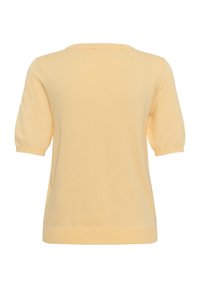 Haut tricoté à manches courtes jaune clair avec un col rond, vu de dos sur fond blanc.