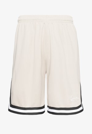 Heledad beeži värvusega spordipüksid, millel on tekstuuriga kangas, elastne vöökoht ja must-valged triibud ääres; sisaldab logoga detaili.