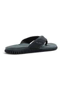 Mustat flip-flop-sandaalit, jotka on valmistettu kumista. Varustettu teksturoidulla hihnalla ja uritetulla pohjalla. Brändinimi "ALDO" on painettu sivulle.