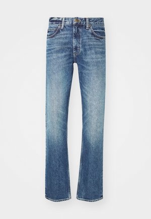 Sinine denim-püksid otse lõikega, millel on pleekinud pesu, viis taskut ja kontrastsed õmblused. Metallsulgur vöökohtadel.