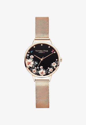 Zegarek z różowego złota z siateczkowym paskiem, czarną tarczą, kwiatowym nadrukiem, motylkowymi akcentami, kryształowymi indeksami godzin oraz logo Victoria Hyde London.