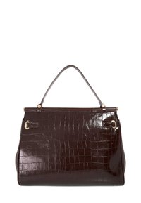 Brown crocodile-embossed leather handbag with a smooth finish, featuring a single handle and gold-tone hardware accents.