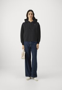 Calvin Klein NANO LOGO ZIP RELAXED - Zip-up sweatshirt - black