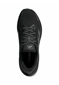 Black athletic shoe with a mesh upper, round toe, textured laces, reflective accents, and cushioned sole. Logo displayed on the side.