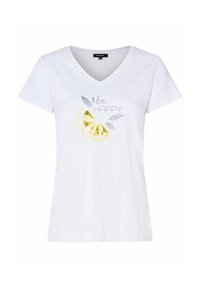 Hvid bomulds V-hals t-shirt med en grafisk illustration af en gul citronskive, sølv tekst og bladdetaljer med ordene "vær GLAD."