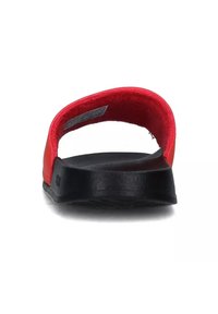 Infradito rossi con interno soffice e suola nera texture, caratterizzati da un design semplice e apertura sul retro per una facile calzata.