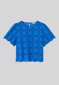 Haut bleu à manches courtes, avec un motif découpé décoratif, un col rond et un ourlet festonné. Fabriqué en tissu léger.