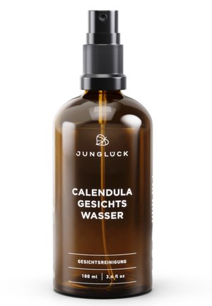 Brown glass spray bottle labeled "Calendula Gesichtswasser" facial toner by Jungluck, 100 ml, with black spray nozzle and drip tube visible.