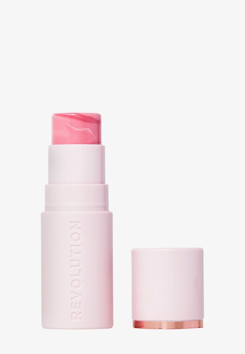 Rosa kremrouge i en matt hvit tube med preget tekst. Lokket er flatt med en rose-gull bunn, som viser et snurret rosa produkt.