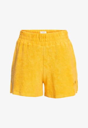 Gula shorts i frotté med elastisk midja; har en mjuk textur, avslappnad form och enkel design, lämpliga för vardagsbruk.