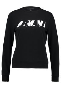 Svart sweatshirt i bomull med långa ärmar. Har en rund halsringning och en stor vit logotyp "ARMANI EXCHANGE" tvärs över framsidan.