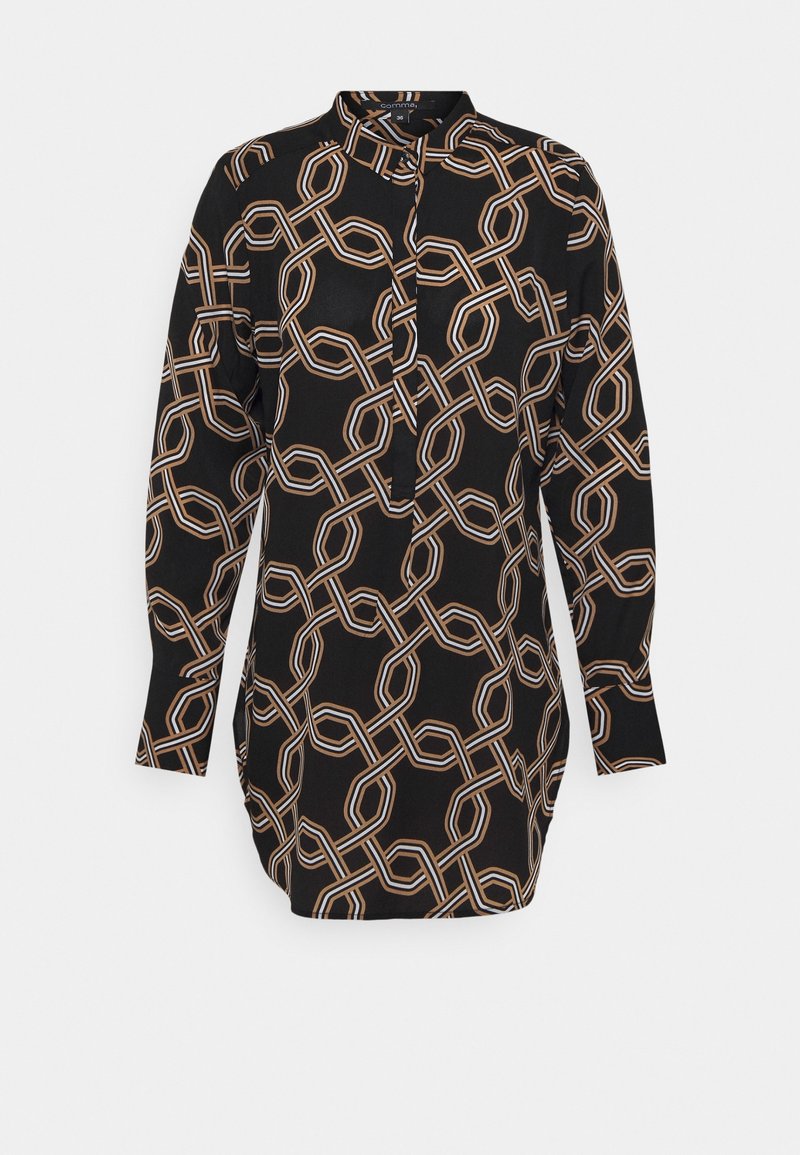 Blouse noire à manches longues avec motif chaîne beige et blanche, patte de boutonnage devant et col montant.