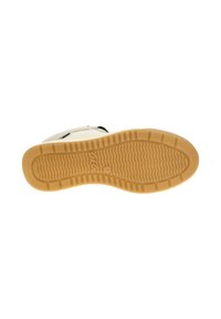 Rubber sneaker sole in beige with textured grip pattern and grooves; lightweight design and rounded toe shape.