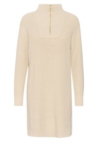 Robe-pull beige en maille à manches longues avec col montant et fermeture éclair à anneau doré sur le devant du col.
