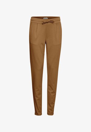 Brune sweatpants lavet af blødt materiale, med snøre i taljen, to fortil lommer og en tapered bendesign.