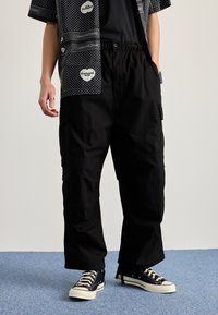 Carhartt WIP JET PANT - Hlačami s stranskimi žepi - black