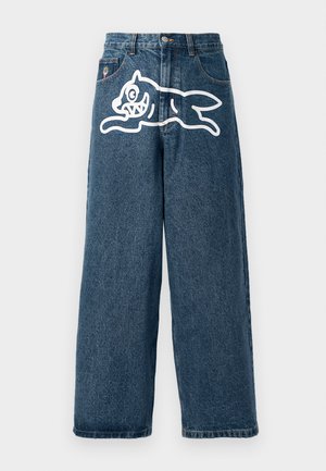 Blue denim wide-leg jeans with a large white graphic of a leaping cat on the back. Classic five-pocket design with metal hardware.
